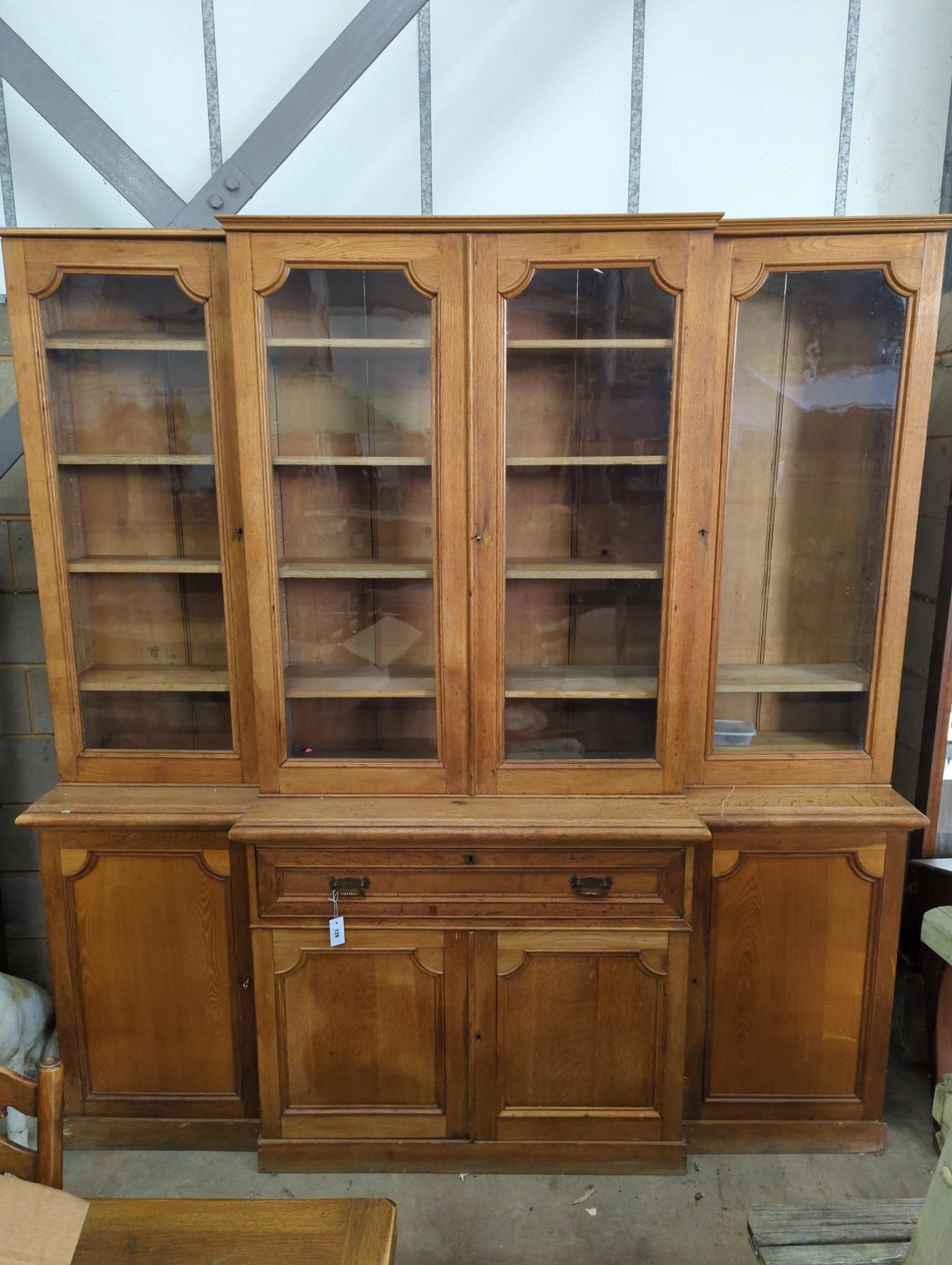 A Victorian pale oak breakfront secretaire library bookcase, length 220cm, depth 47cm, height 230cm